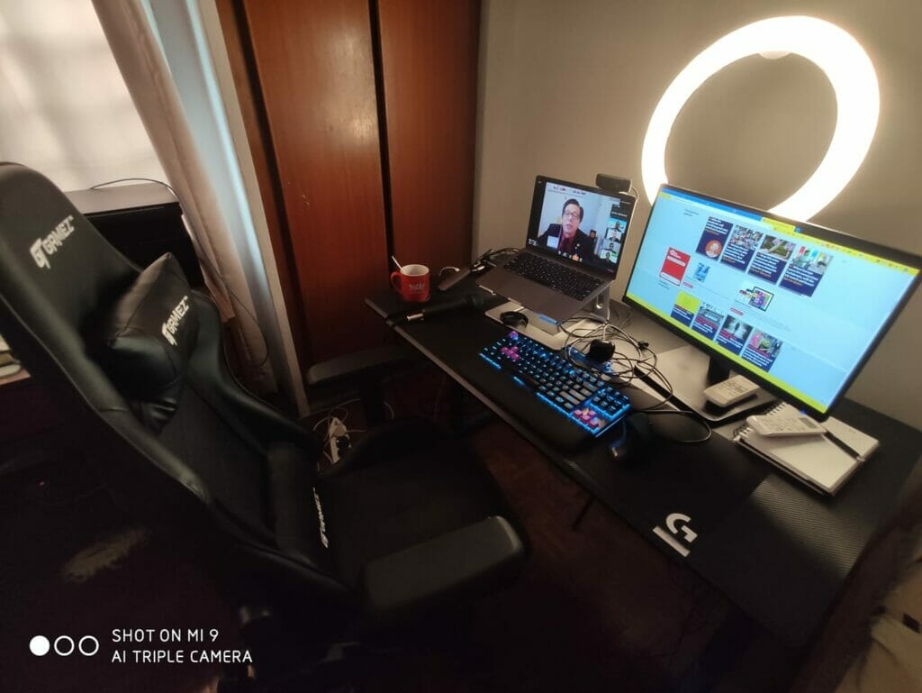 A gaming desk with a laptop and a monitor.